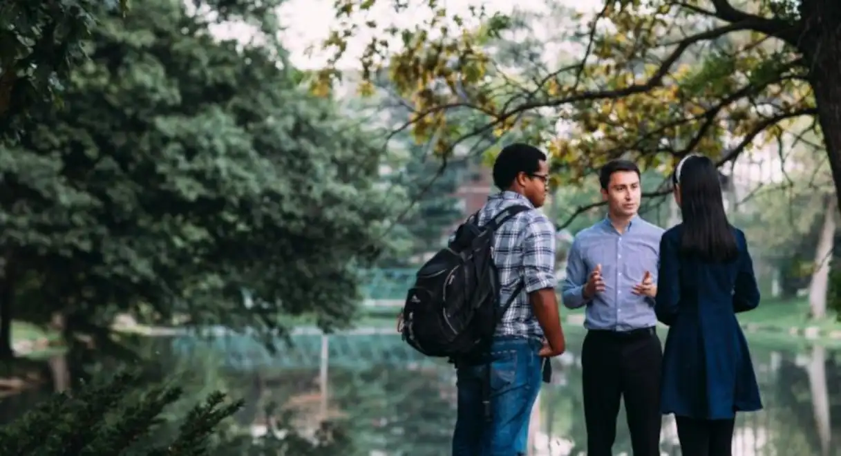 People Talking By Pond